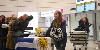 Aplauso, medalla y beso