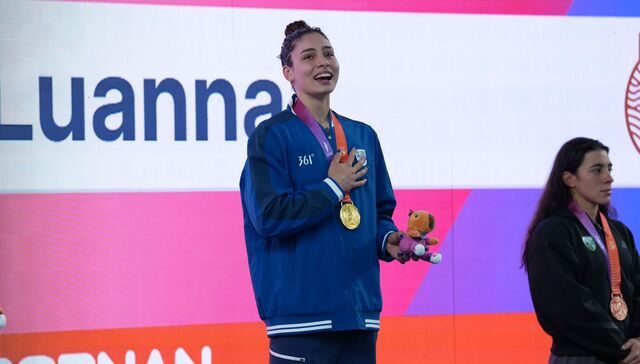 Aplauso, medalla y beso
